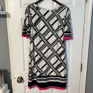 White dress with navy, black, gray and pink design.